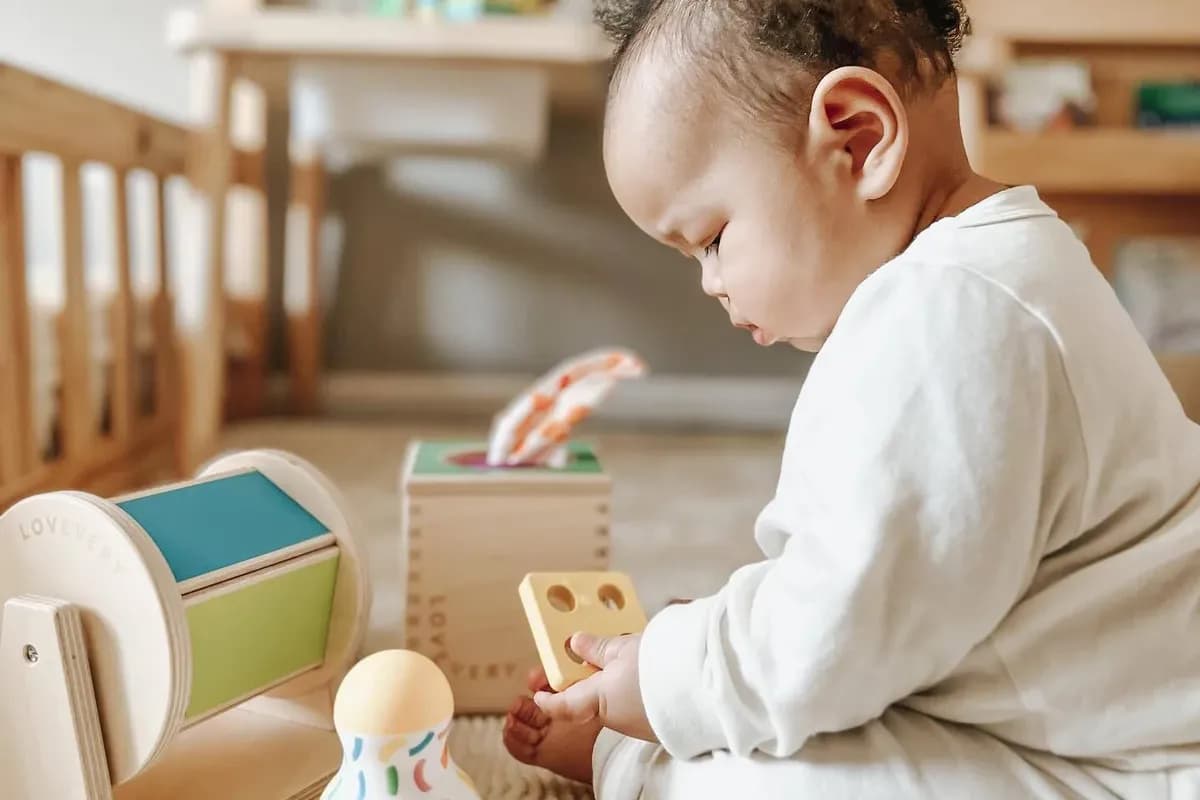 Child looking at toys from The Senser Play Kit